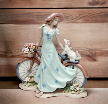 Cosmos Gifts 10414 Fine Elegant Porcelain Lady Riding Bike With My Best Friend Dog Puppy Porcelain Figurine, 10 5/8' H