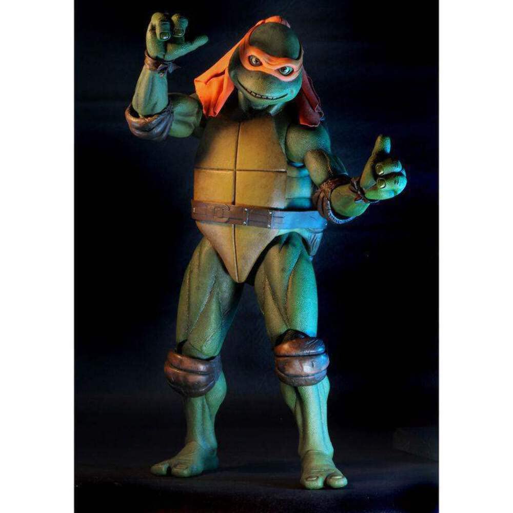 Neca Teenage Mutant Ninja Turtles 1990 Movie 16.5-Inch Michelangelo Action Figure With Two Nun Chucks, Slice Of Pizza, Bag Of Pork Rinds, And Alternate Interchangeable Hands