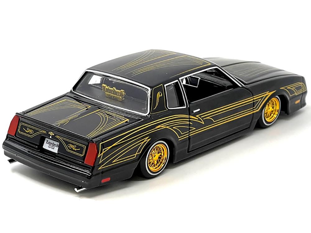 1986 Chevy Monte Carlo Ss Lowrider Black Metallic With Gold Graphics And Wheels Lowriders Series 1/24 Diecast Model Car By Maist