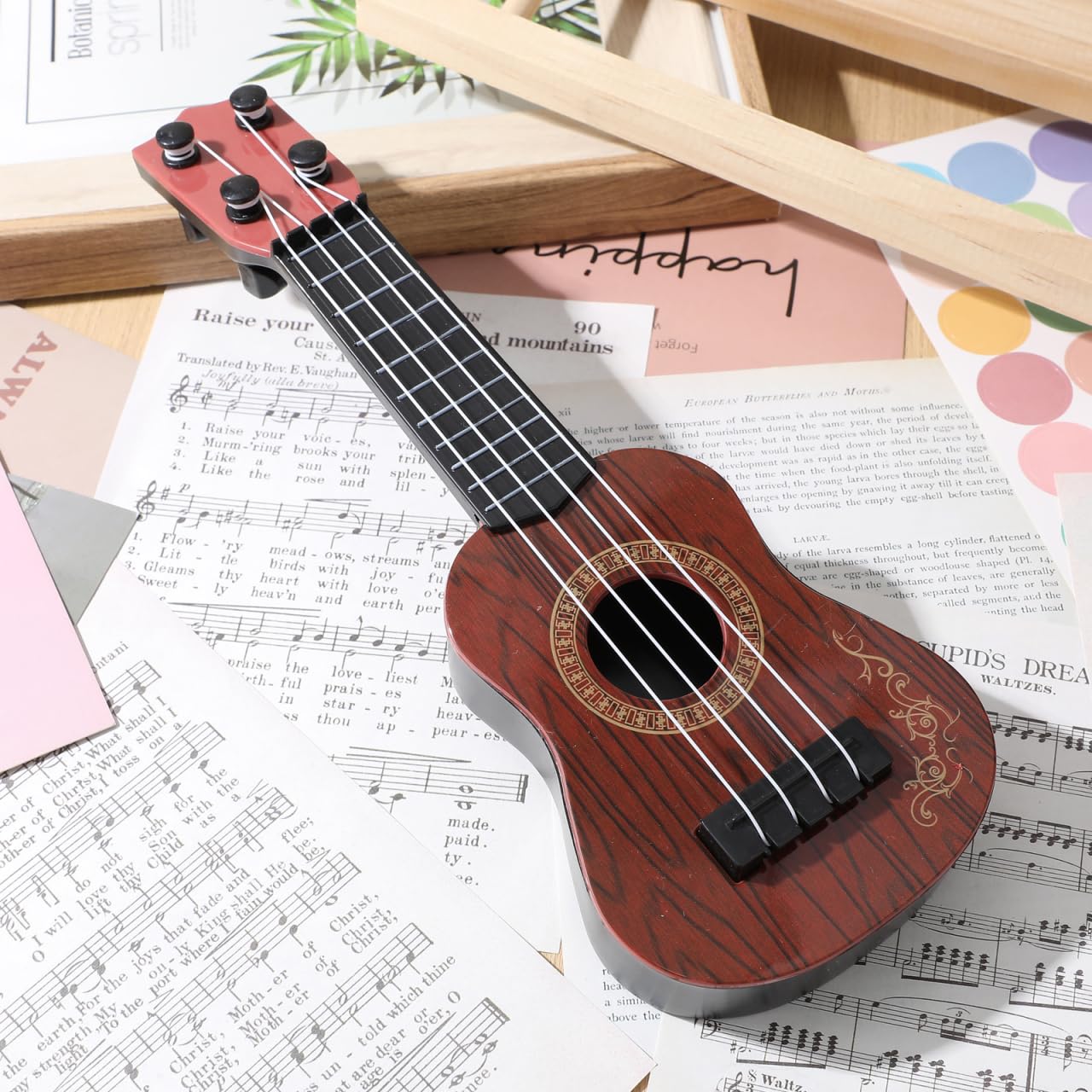 Toddmomy Melodic Fun for Kids: Plastic Ukulele Guitar - A Musical Toy Instrument for Children, Inspiring Musical Education and P