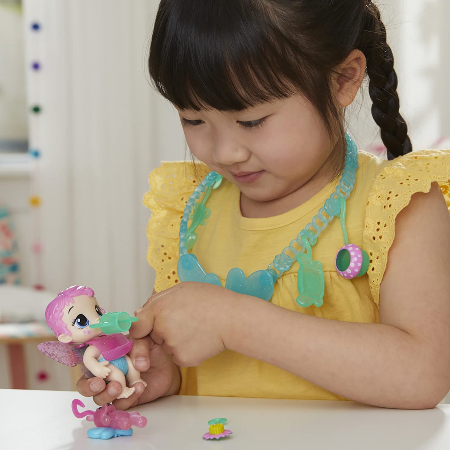 Baby Alive Glo Pixies Minis Carry ‘N Care Necklace, Sugar Sprinkle, 3.75-Inch Pixie Doll Toy With Doll Carrier And Nurturing Charm Necklace