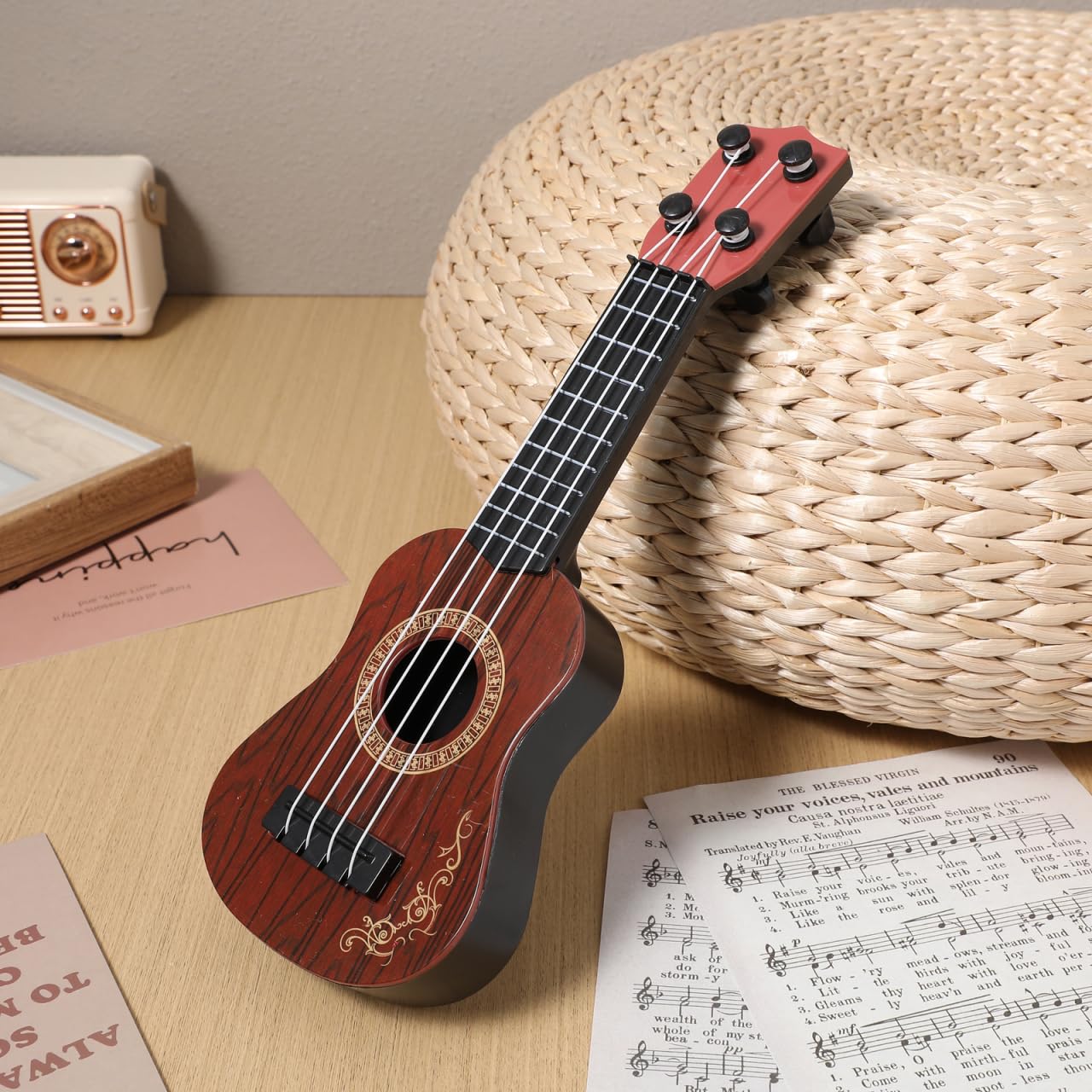Toddmomy Melodic Fun for Kids: Plastic Ukulele Guitar - A Musical Toy Instrument for Children, Inspiring Musical Education and P