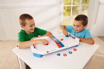 International Playthings Electronic Table-Top Air Hockey - Fast-Paced Sports Fun In An Easily Portable Battery-Operated Rink For Ages 5 And Up (P25118)