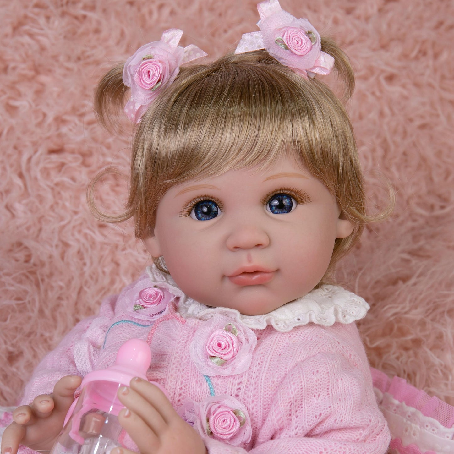 EKOKIZ Realistic Baby Doll 22-Inch Newborn Baby Doll Soft Cloth Body Lifelike Reborn Baby Dolls Cute Girls with Clothes and Toy