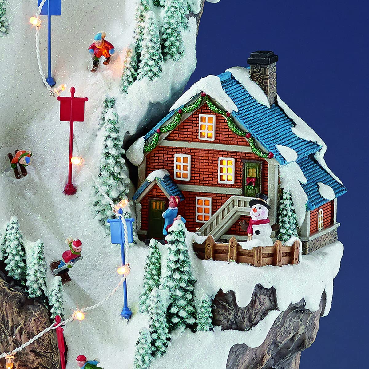MOMENTS IN TIME Animated Ski Resort Christmas Village, 20.5”H, LED Lights, Music & Moving Train, Hand-Painted Resin, Model NM-X16038AA