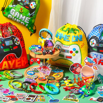 Sadnyy 140 Pcs Video Game Party Favors Birthday Party Decorations Supplies Drawstring Bags with Silicone Bracelets Keychains Str