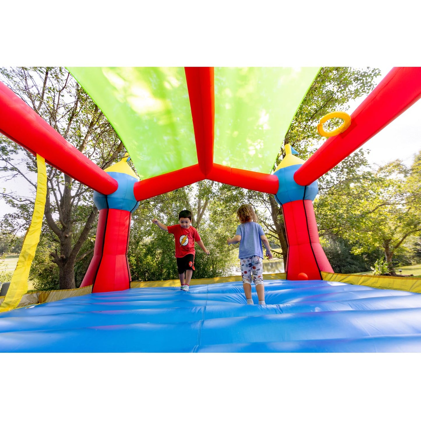 Bounceland Inflatable Party Castle Bounce House Bouncer, 16 ft L x 13 ft W x 10.3 ft H, Basketball Hoop, Removable Sun Roof, UL