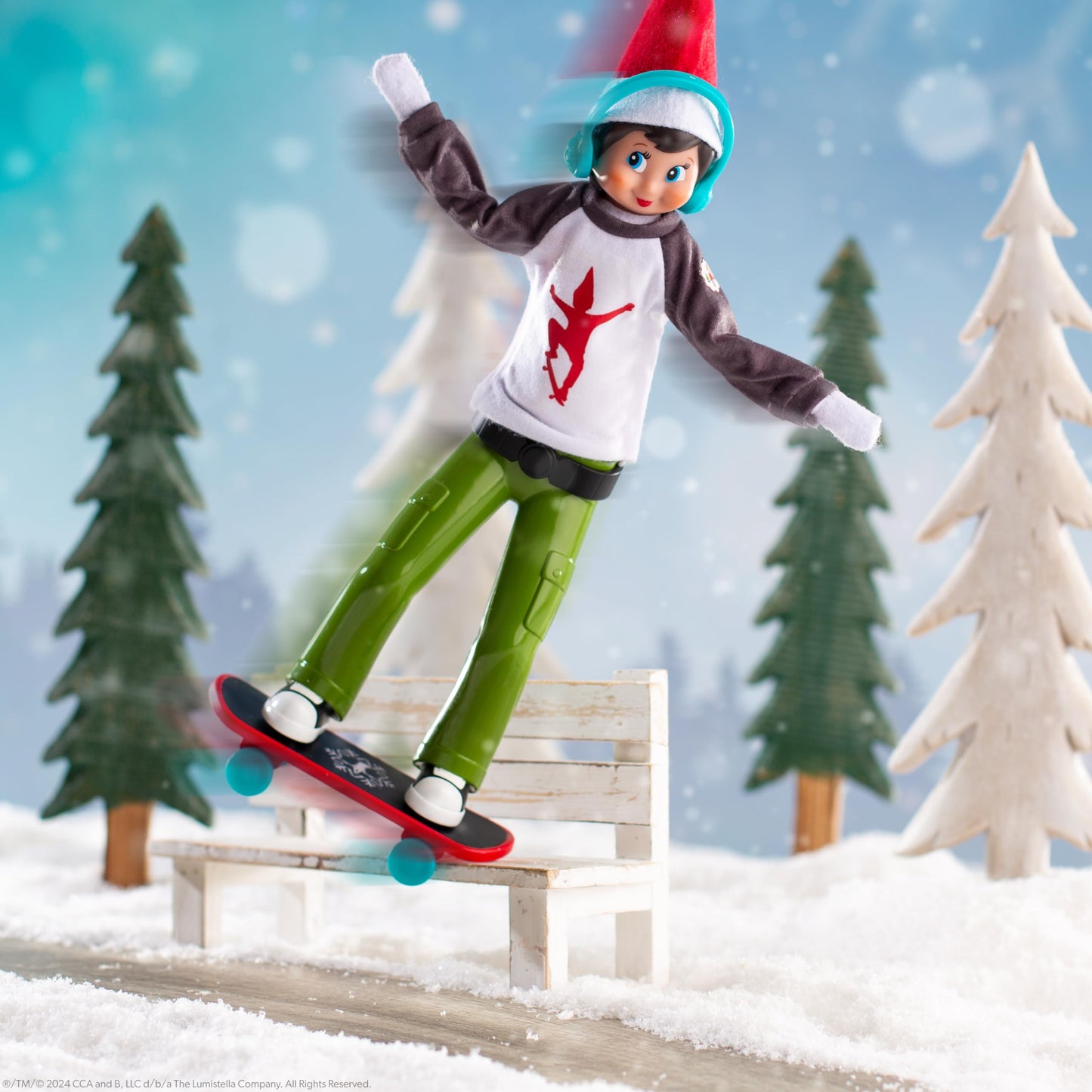 The Elf on the Shelf Skateboard Set - MagiFreez Holly Jolly Ollie, Includes Stand Pants, Tee, Headphones, and Skateboard