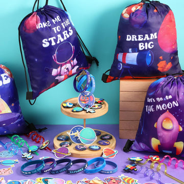 Sadnyy 140 Pcs Space Party Favors Outer Space Gift Bulk Galaxy Drawstring Backpack with Silicone Bracelet Straws Keychains Pin B