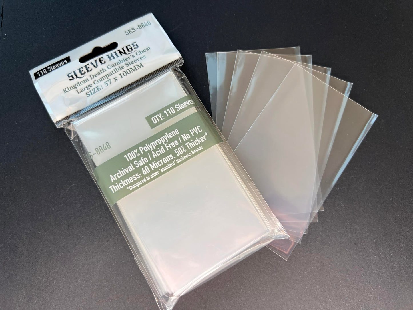 Premium Card Sleeves: 'Kingdom Death Gambler'S Chest Large Compatible Sleeves (57 X 100 Mm) -110 Per Pack