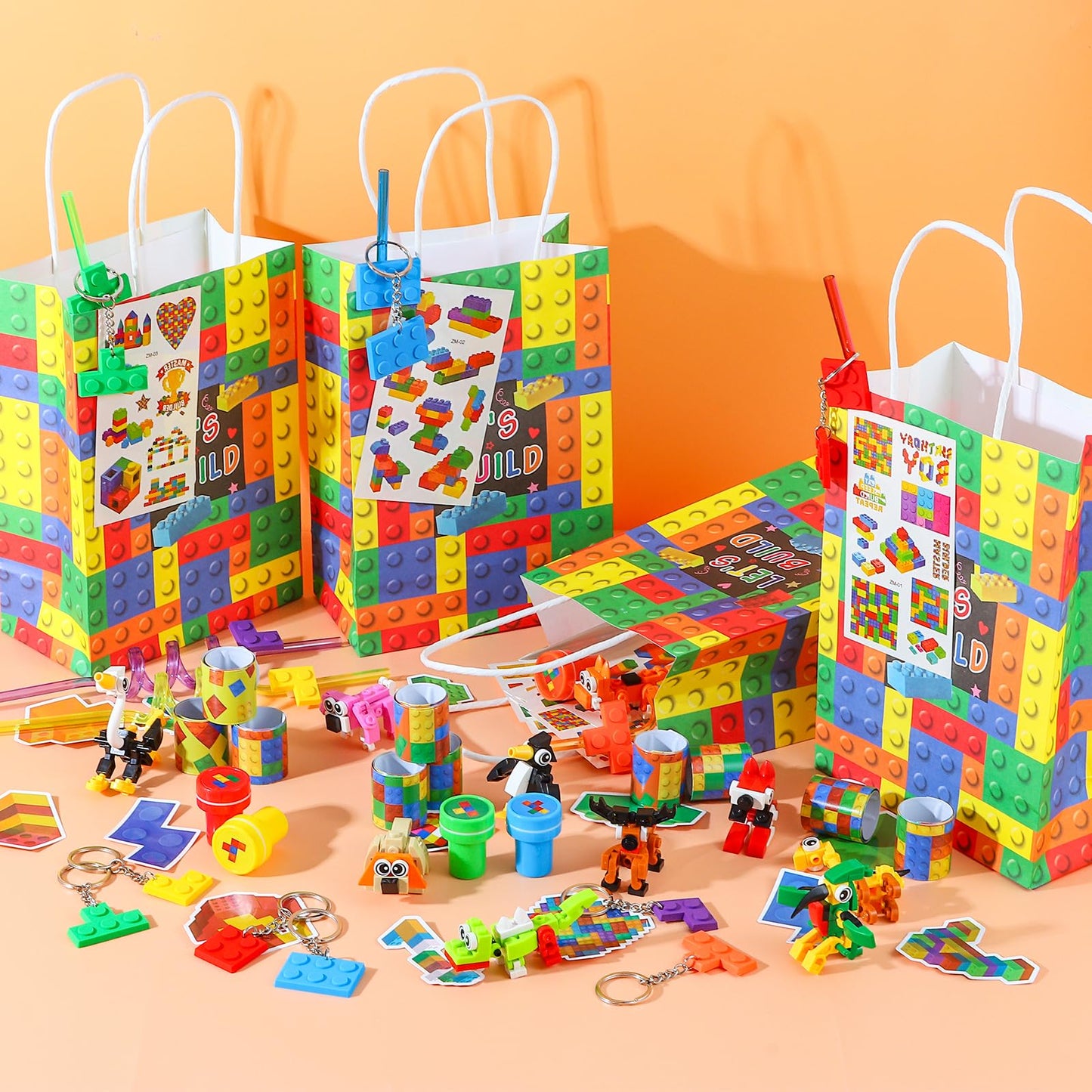 LiYiQ 134 Pcs Building Blocks Party Favors with Reusable Drinking Straws Animal Building Blocks Slap Bracelets Keychains Stamps