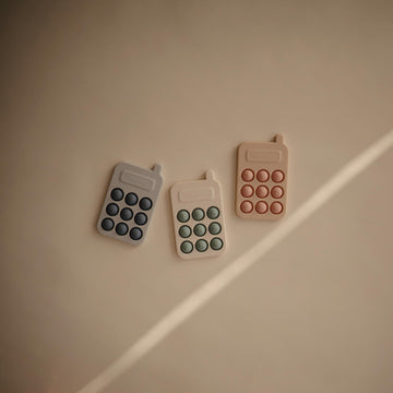 Mushie Phone Press Toy (Tradewinds)
