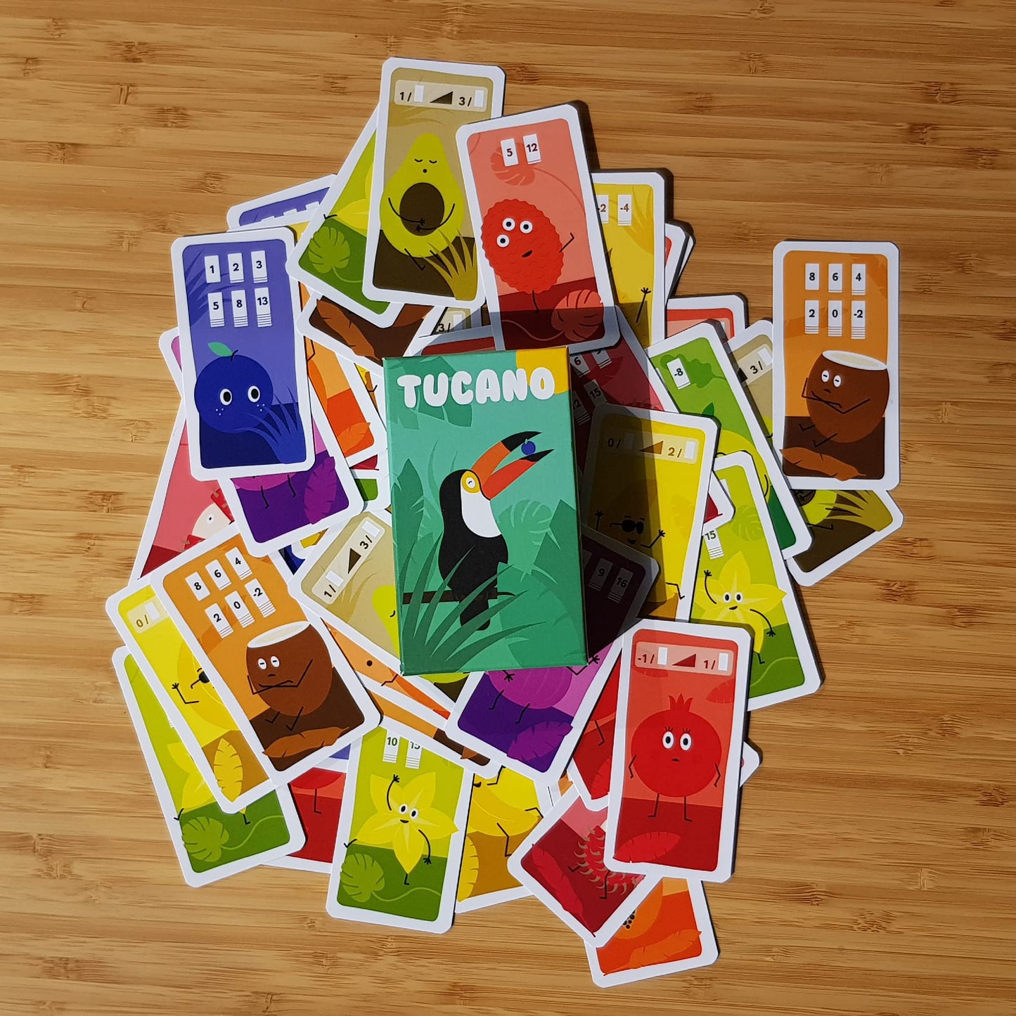 Tucano Card Game - A Tropical Strategy Adventure Of Juicy Fruits And Clever Tactics! Fun Family Game For Kids & Adults, Ages 6+, 2-4 Players, 15 Minute Playtime, Made By Helvetiq