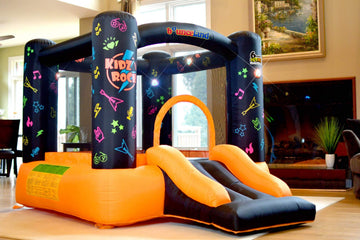 Bounceland Kidz Rock Bounce House - Inflatable Bouncer with Music & Lights, 9ft L x 7ft W x 5.5ft H, Orange & Black, Model