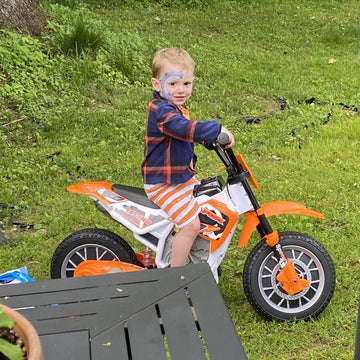 AOKOY 12V Ride On Motorcycle for Kids, Medium Electric Dirt Bike, Orange, Battery Powered with Training Wheels, Music Player