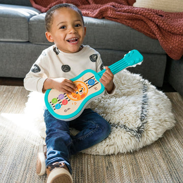 Baby Einstein Sing & Strum Ukulele Toy, Wooden Musical Instrument for Ages 6 Months+, Multicolored, Model 12609