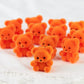 Factory Direct Craft Package Of 24 Sitting Flocked Orange Miniature Teddy Bears - Tiny Bear Shaped Figurines (Size: 1 Inch)