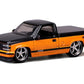 1993 454 SS Pickup Truck Black and Orange Metallic Design Series 1/64 Diecast Model Car 15494-23B