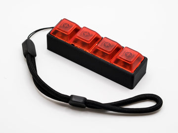 Four-Button Clicky Mechanical Switch Fidget Toy | Stim Toy, Stress Relief, Adhd (Black Base, Transparent Red Keycaps)