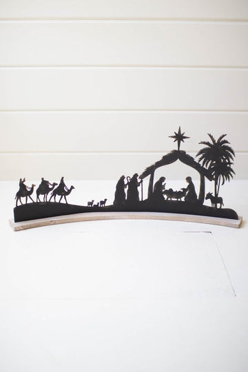 BLACK METAL NATIVITY ON A CURVED WHITE WOOD BASE