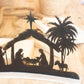 BLACK METAL NATIVITY ON A CURVED WHITE WOOD BASE