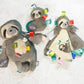 Taggies Sensory Stuffed Animal Soft Rattle with Teether Ring  Molasses Sloth