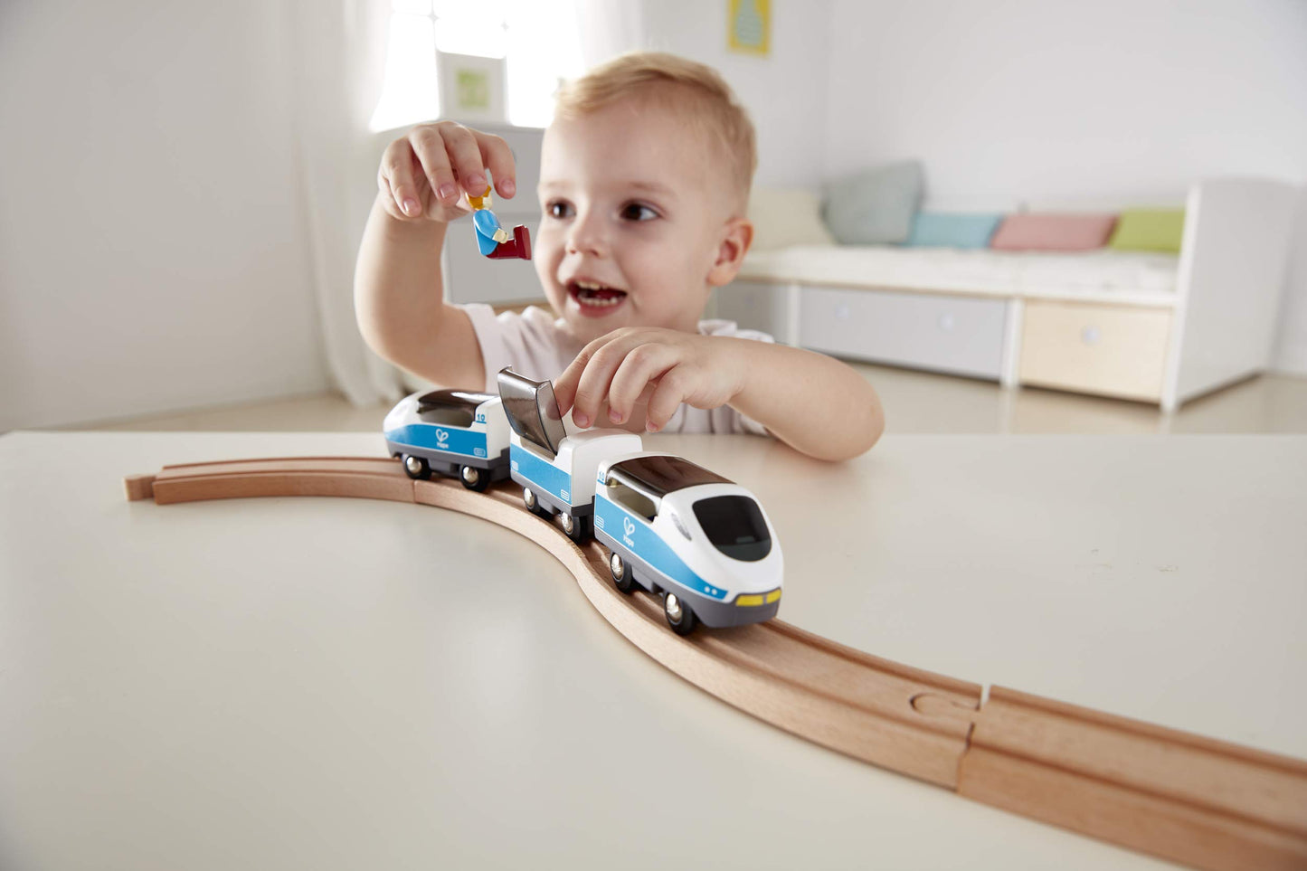 Hape Intercity Train Toy Set, 7 Pack with Magnetic Carriages, 10.63" x 1.5" x 1.97", Multicolor, Includes Passenger & Driver Figur