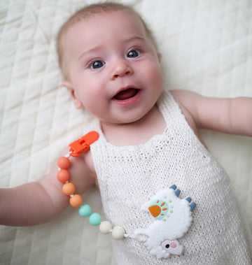 Nuby All Silicone Teether With Bonus Silicone Pacifinder With Clip - 3+ Months, 1Pk, Assorted Neutral Designs