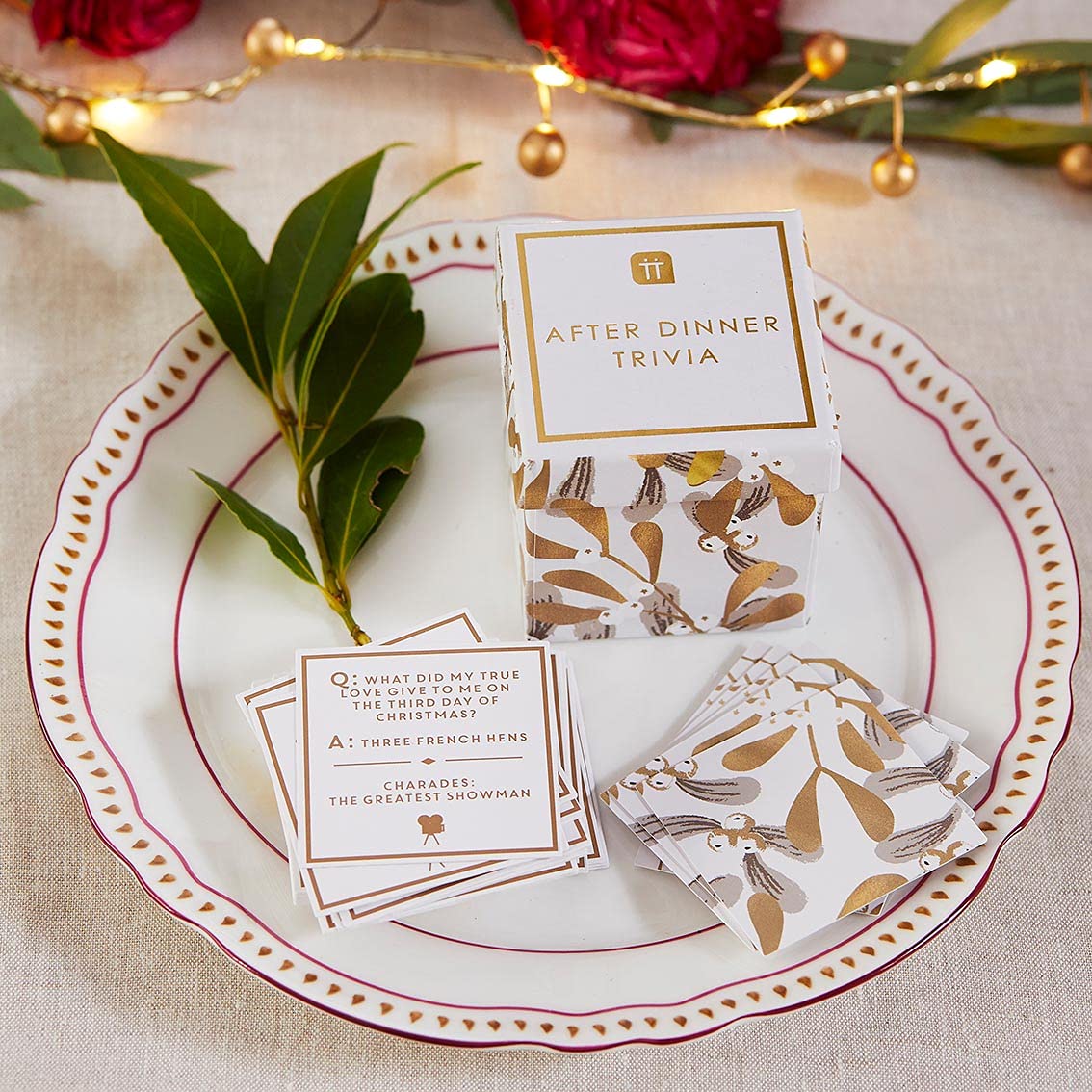 Talking Tables Christmas Trivia Quiz Questions & Charades Cards | After Dinner Table Game in Mistletoe Box | Xmas Gifts for Him or Her  Stocking Stuffer  Gold