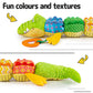 The Cuddle Croc, Musical Stuffed Infant Activity Toy with Teether, Rattle & Crinkles