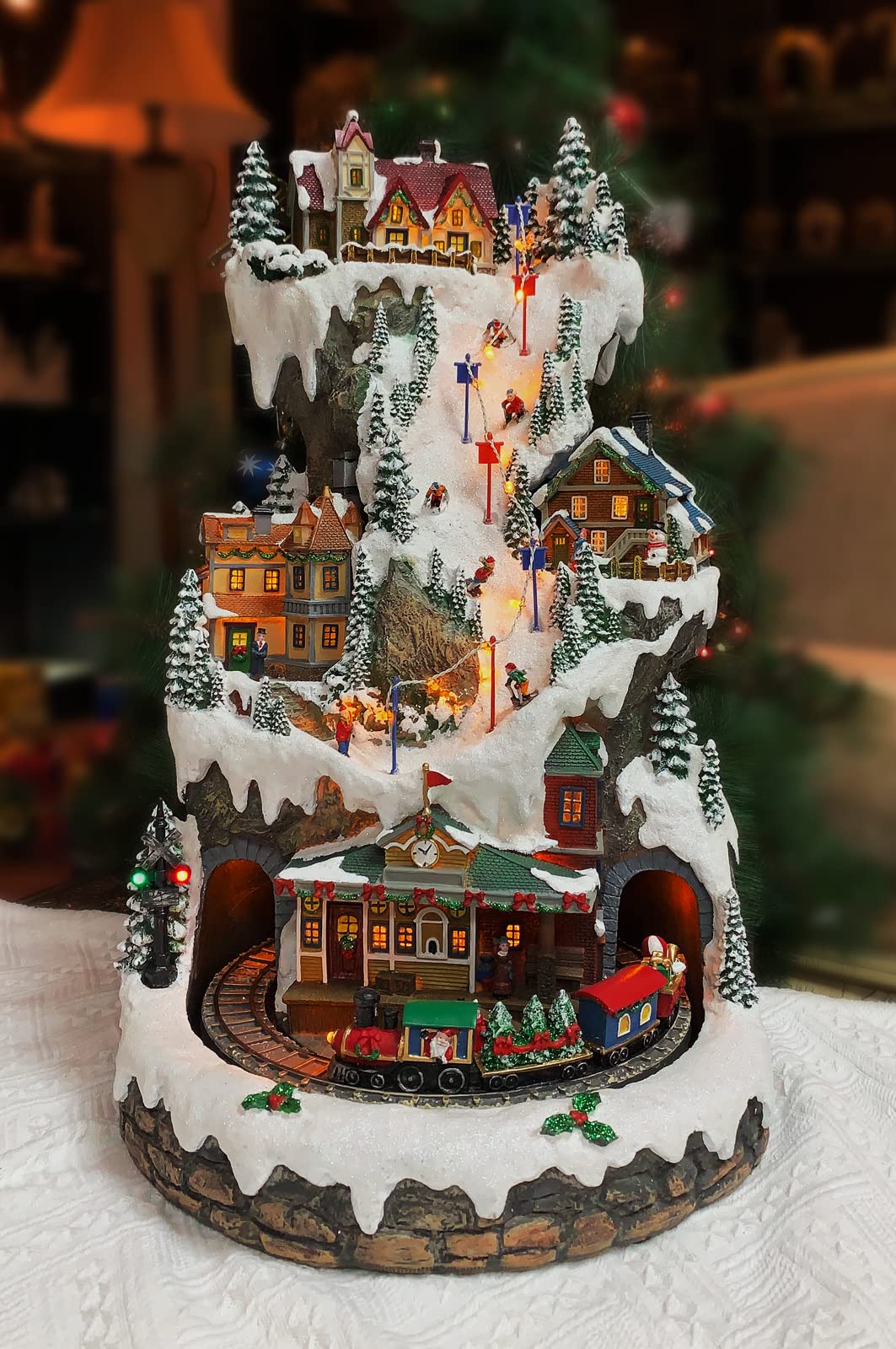 MOMENTS IN TIME Animated Ski Resort Christmas Village, 20.5”H, LED Lights, Music & Moving Train, Hand-Painted Resin, Model NM-X16038AA