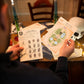 Talking Tables Murder Mystery At The Botanic Gardens Dinner Party Game For Adults, Puzzle Games, Clues, Brain Teaser Puzzles Secret Santa, Ages 16+, 5-13 Players
