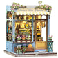 CUTEBEE Book Nook Kit - DIY Miniature House Dollhouse Kit for mature-themed and Teens  Booknook Bookshelf Decor Alley Model Build with LED Light  Gifts for Family and Friends (Anna 's Blue Blossom)