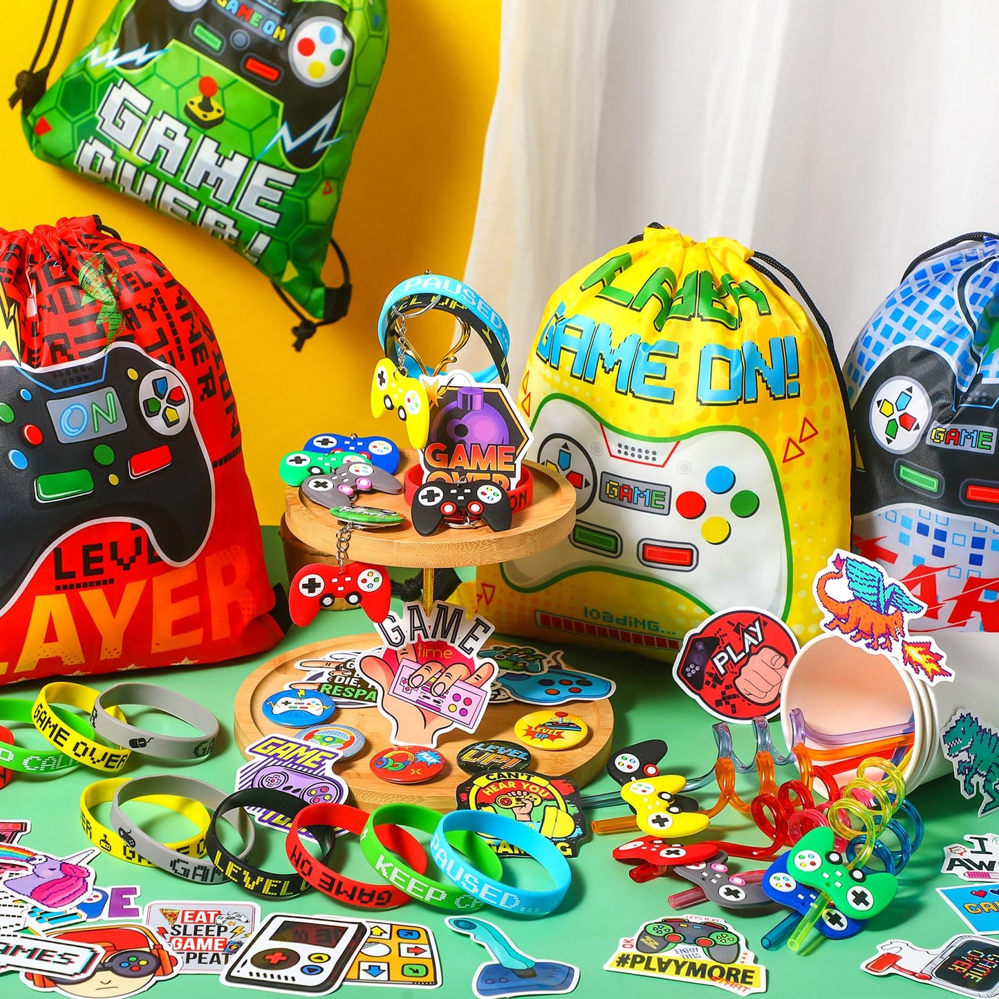 Sadnyy 140 Pcs Video Game Party Favors Birthday Party Decorations Supplies Drawstring Bags with Silicone Bracelets Keychains Str