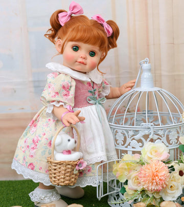 Cloveray Baby Doll  18 Inch Realistic Reborn Toddler Real Life Baby Dolls with Vintage Floral Dress  Little Bear & Woven Basket  enhanced Collectible Doll Gifts for 3+ Year Old Girls