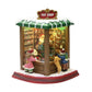 MOMENTS IN TIME Lighted Santa’s Toy Shop Village, 8.8” Battery Operated LED, Music & Animation, Red, Model NM-X20135AA
