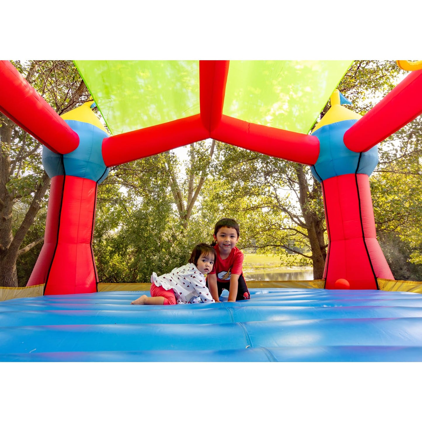 Bounceland Inflatable Party Castle Bounce House Bouncer, 16 ft L x 13 ft W x 10.3 ft H, Basketball Hoop, Removable Sun Roof, UL
