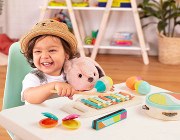B. Toys- Make A Melody- 9Pc Wooden Musical Instruments – Xylophone, Tambourine, Harmonica – Drawstring Storage Bag – 2 Years +