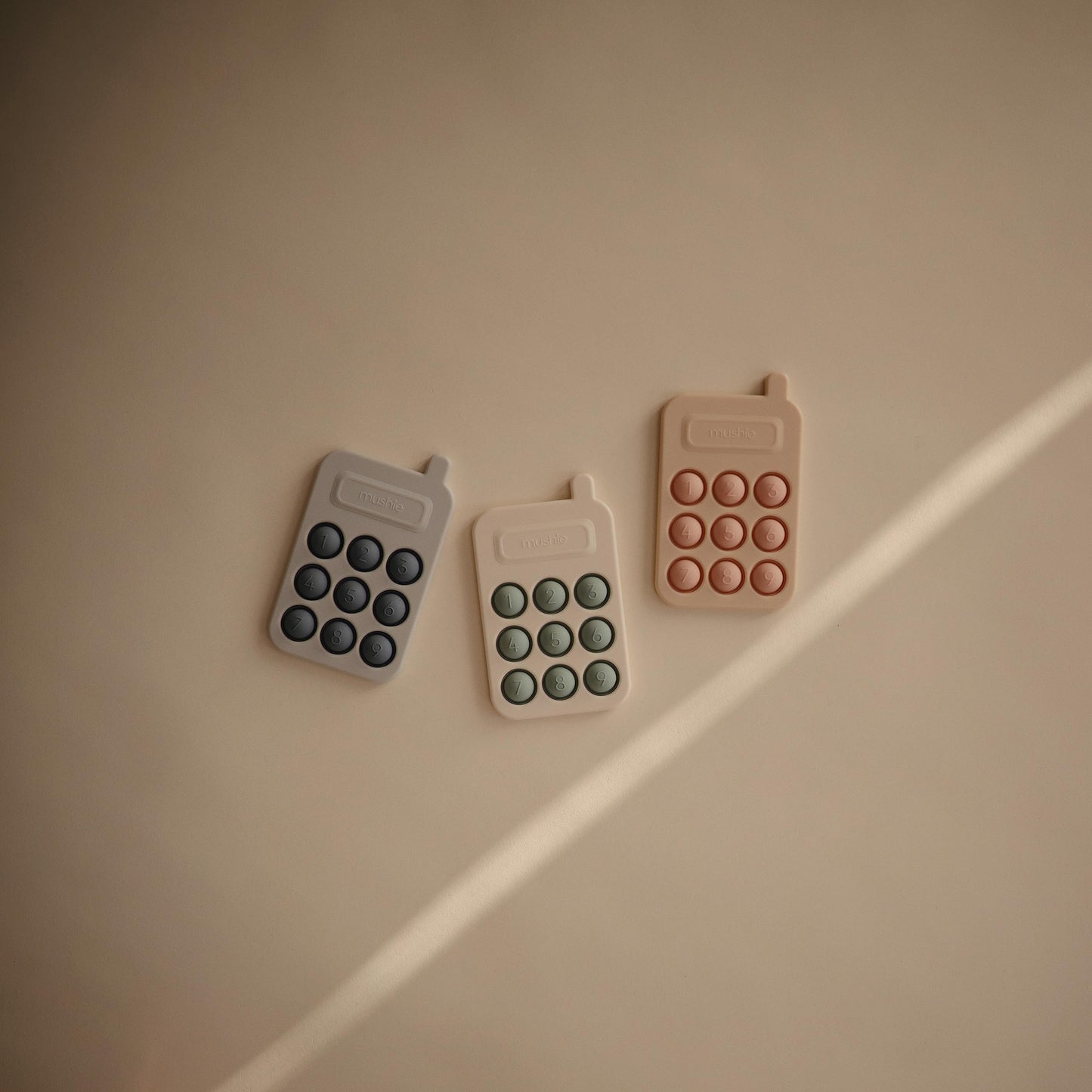 mushie Phone Press Toy (Cambridge Blue)