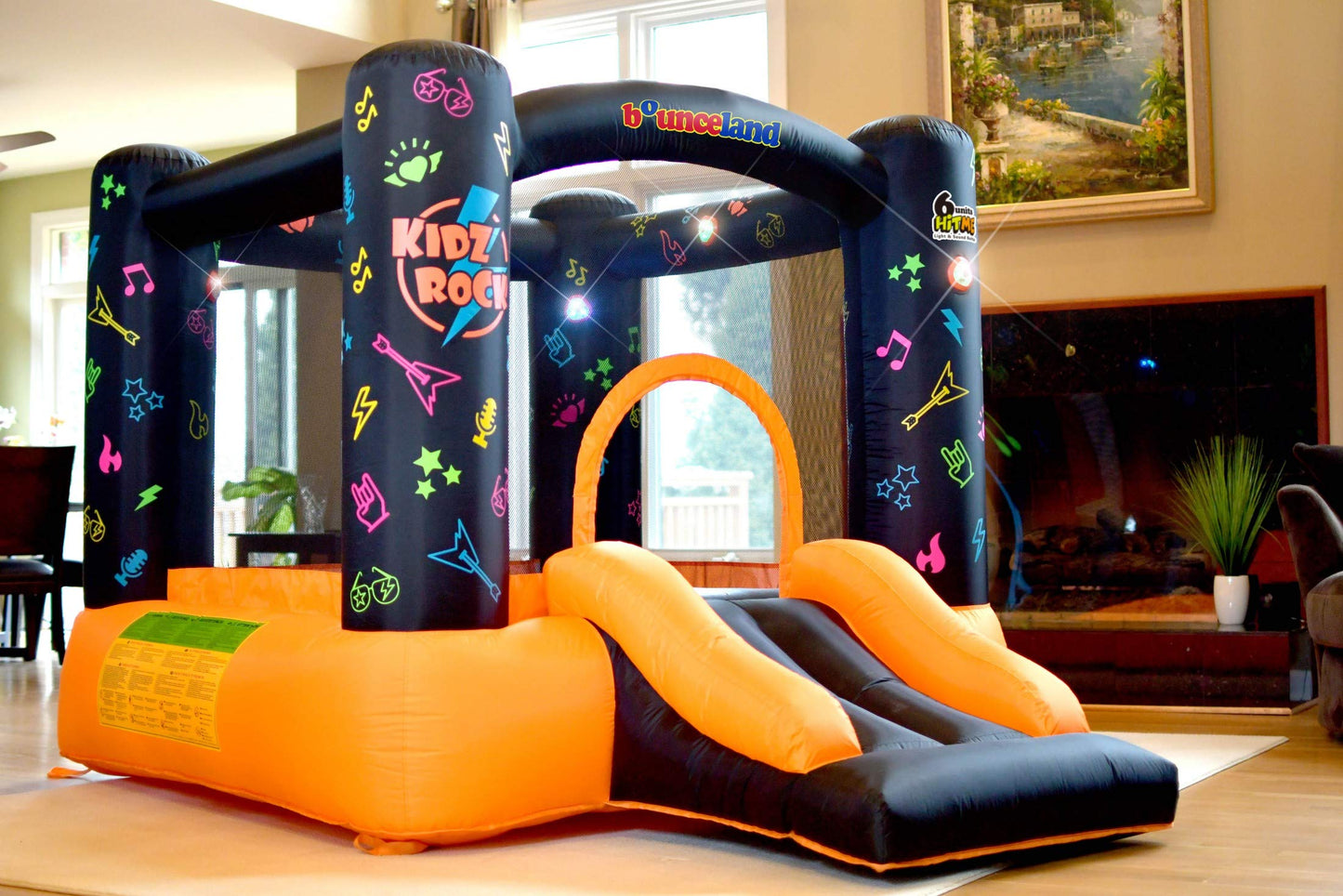 Bounceland Kidz Rock Bounce House - Inflatable Bouncer with Music & Lights, 9ft L x 7ft W x 5.5ft H, Orange & Black, Model