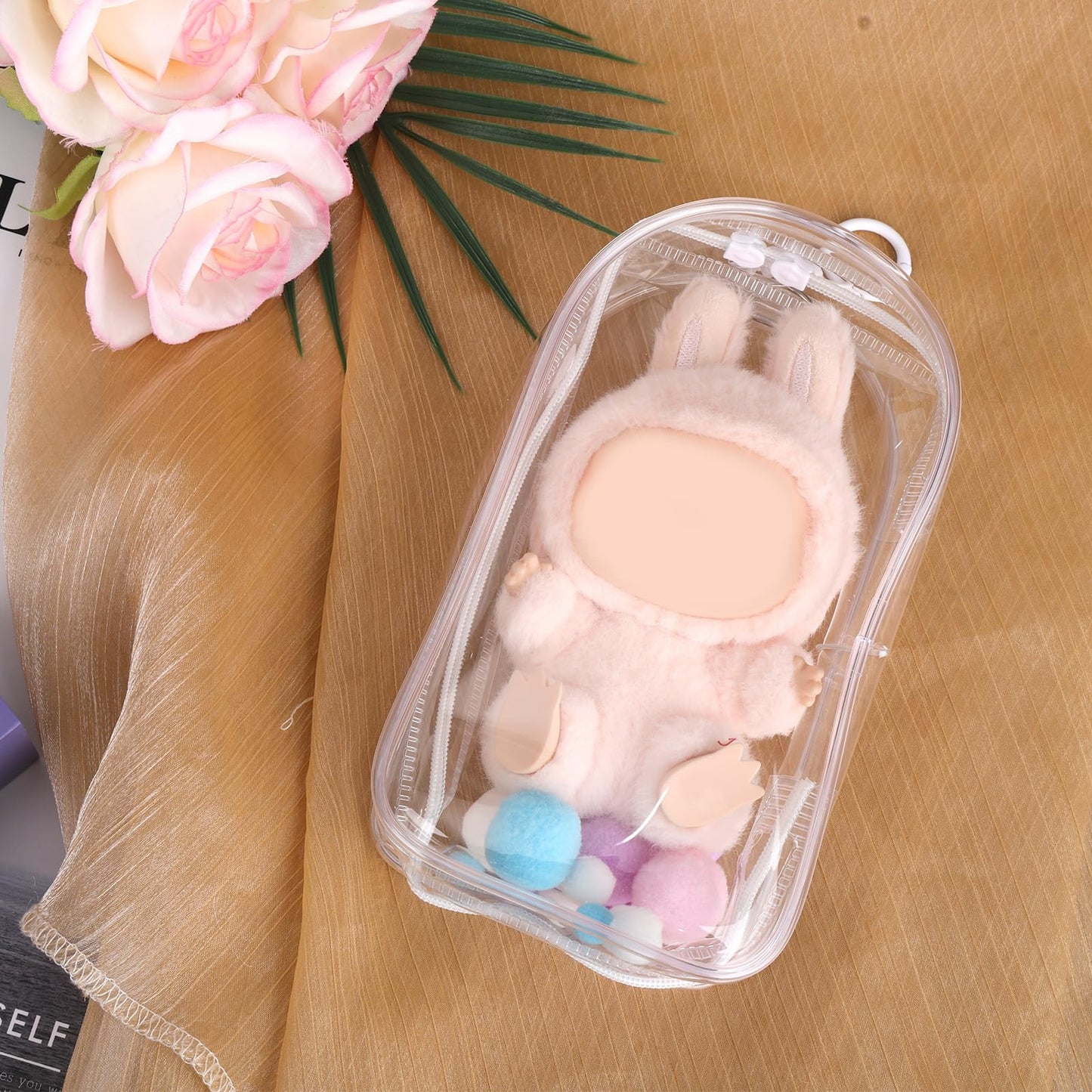 Tinoaly 2Pcs Protective Case For Dolls, 7.68X4.13 Inch Waterproof Pvc Clear Cover Figure Display Bag Keychain Holder With Pompom
