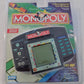 Hasbro Monopoly Electronic Handheld Game - Interactive LCD - 6"x7.1"x1.5"