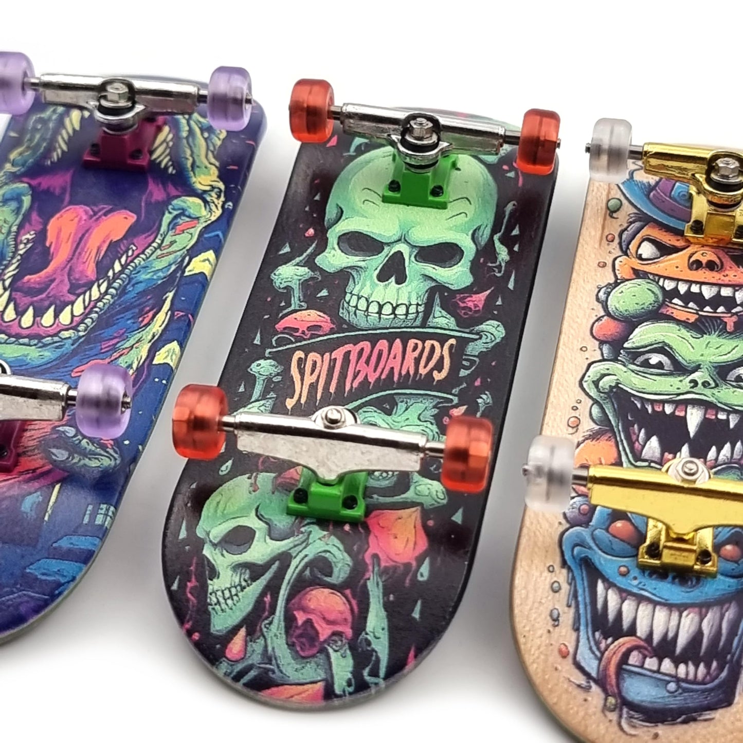 Spitboards® 32 X 96 Mm Fingerboard Complete Wood Set-Up Assembled, 5-Layers, Silver Trucks With Bushings And Nuts, Transparent Cnc Bearing Wheels, Lasered Foam Grip Tape Orange Green Skull