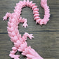Munnygrubbers - Xl 26' Crystal Dragon Fidget Toy - Heavy Duty - 3D Printed Flexible Articulating Dragon Plastic Collectible Figurine - Surprise Egg Compatible - (Pink Dragon)