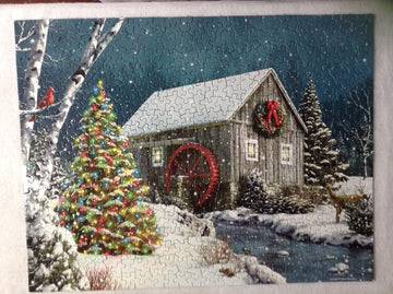 Springbok The Falling Snow 500 Piece Jigsaw Puzzle For Adults Features A Holiday Cabin Glowing In The Snow With A Decorated Christmas Tree Beside It