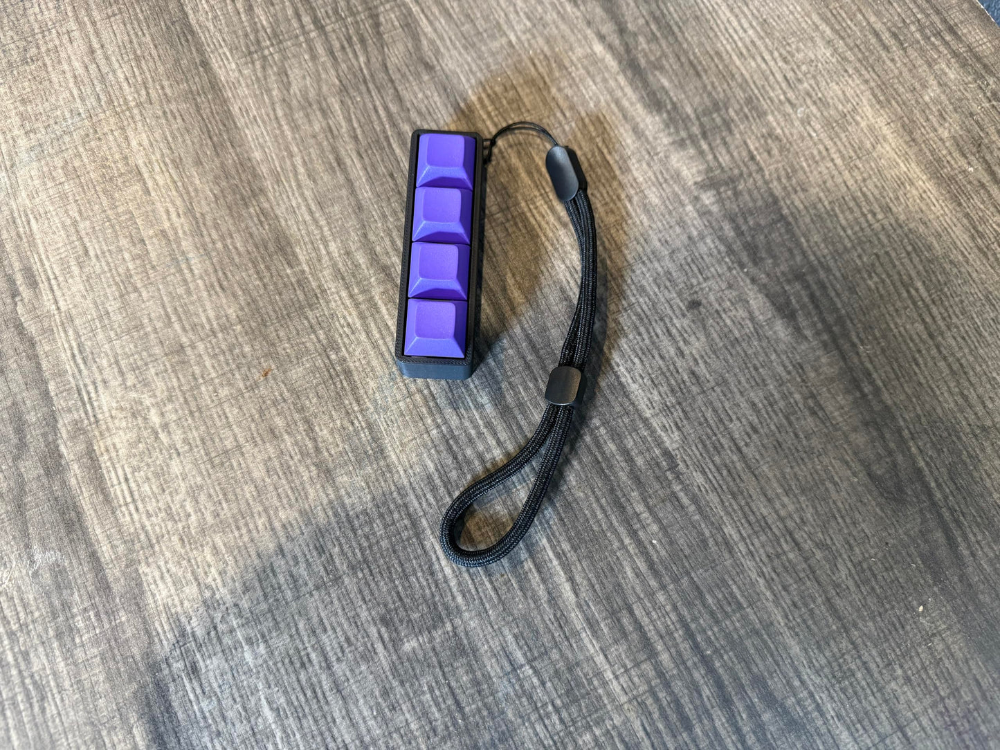 Zkeebs Four-Button Clicky Mechanical Switch Fidget Toy - Plastic, Purple Keycaps, Stress Relief, ADHD - Black Base