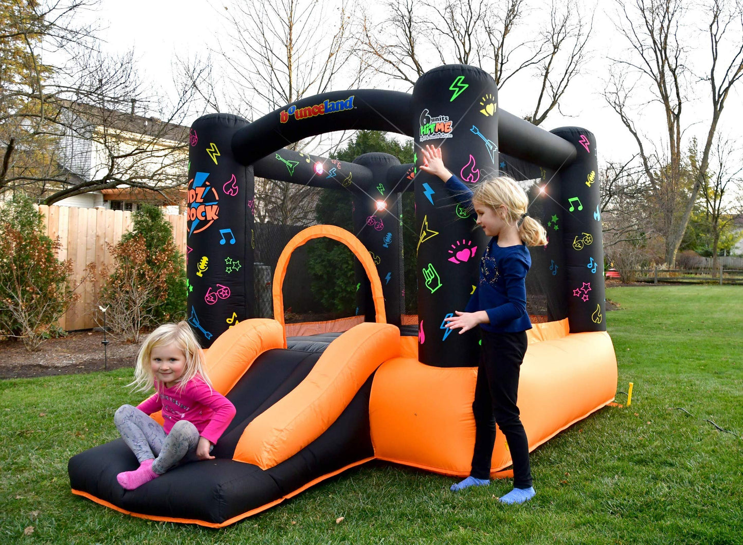 Bounceland Kidz Rock Bounce House - Inflatable Bouncer with Music & Lights, 9ft L x 7ft W x 5.5ft H, Orange & Black, Model