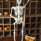 Rustic White Metal Skeleton On A Stand