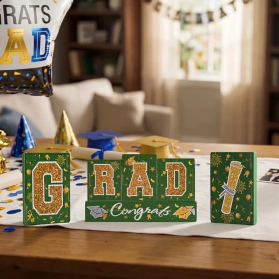 Graduation party tabletop decor set: wooden blocks in green and gold, glittered letter blocks with 'Congrats' banner and tie tr