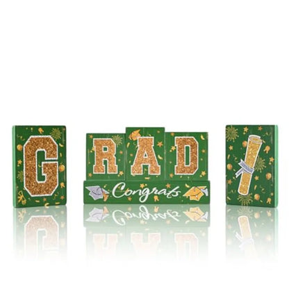 Graduation party tabletop decor set: wooden blocks in green and gold, glittered letter blocks with 'Congrats' banner and tie tr